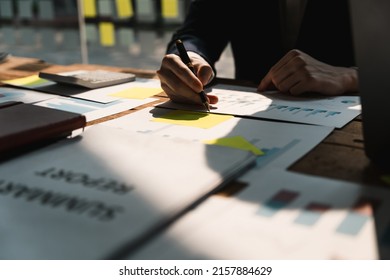 Close up accounatant using calculator, managing household monthly budget, summarizing taxes or bills, planning future investments, doing financial affairs at home, accounting bookkeeping concept - Shutterstock ID 2157884629