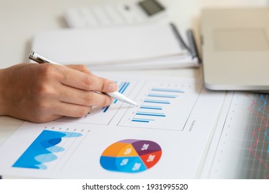 Close Up Of Accountant Working And Analyzing Financial Reports Project Accounting With Chart Graph And Calculator In Modern Office : Finance And Business Concept.