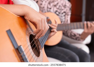 close up of acoustic guitar. playing songs together - Powered by Shutterstock