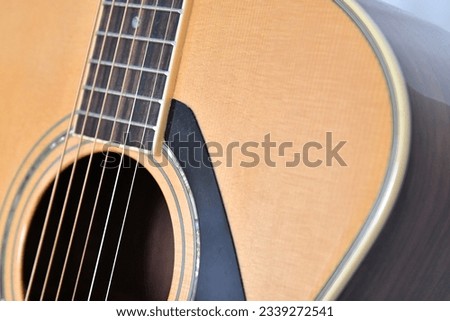 Close up of acoustic wooden guitar 