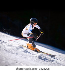 A Close Up Action Shot Of A Downhill Skiier