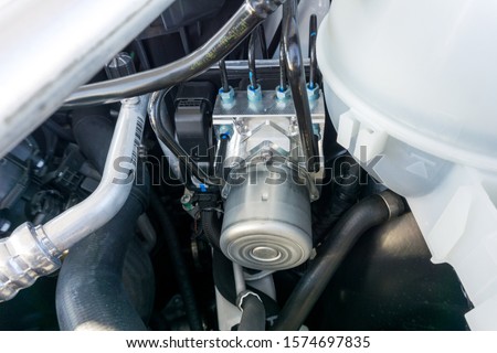 Close up actuator brake controller or Control Unit brake system / driving dynamic Stability control module with Hydraulic hose, brake system in modern car