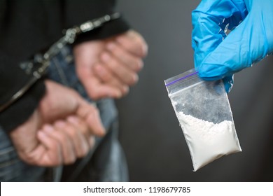 Close Up Of Addict Narcotics Dose Cocaine. Drug Addict Was Arrested, Police Officer Finds Drugs During The Search