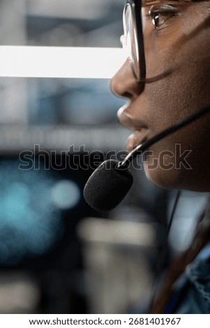 Close up of admin in data center providing technical support to customers, troubleshooting issues. High tech server hub employee carrying out operational technical interventions requested by clients