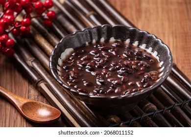 Close Up Of Adzuki Red Bean Soup In A Bowl On Wooden Table Background For Eating.