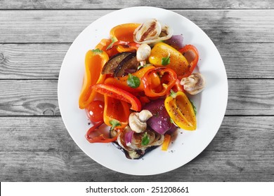 Close up Aerial Shot of Appetizing Healthy Recipe with Mushrooms and Spices on White Plate. Placed on Wooden Table. - Powered by Shutterstock