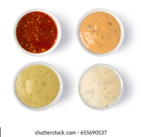 Close up Aerial Shot of Assorted Spicy Sauces on Saucers, Isolated on White.