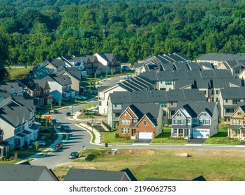 Close Up Aerial View Of A Curving Street With Newly Built Single Family Homes Real Estate In A New East Coast USA Neighborhood