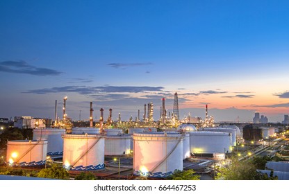 Close up Aerial view at oil   gas industrial Oil refinery plant form industry Refinery factory   oil storage tank and sunset