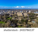 A close up aerial view towards the cathedral and grounds in Peterborough, UK on a bright sunny day