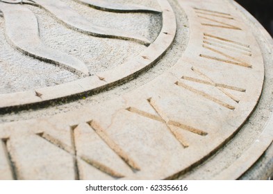 Close Up Af A Solar Clock Fragment With Ancient Roman Numbers Inscribed On It