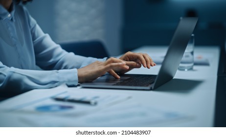 Close Up of African American Businesswoman Working on Laptop Computer in Big City Office Late in the Evening. Female Executive Director Managing Digital e-Commerce Project, Finance Analysis.