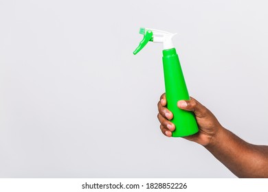 Close Up Of African American Man Hand Holding Spray Bottle. Isolated On White Background, Copy Space For Advertise. With Clipping Path For Hand And Spray Bottle.