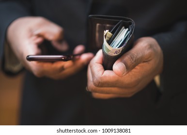 Close Up Of African American Man Using Mobile Device