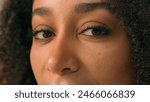 Close up African American woman eyes eyesight vision female looking skin makeup focused face cosmetics facial expression beauty model femininity eyelash mascara trendy extension individuality staring