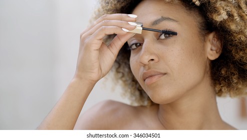 Close Up Of African American Woman Face With Mascara Brush 