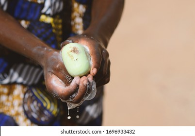 Close Up Of African Black Boy Washing Hands To Avoid Contacting Virus Like Coronavirus