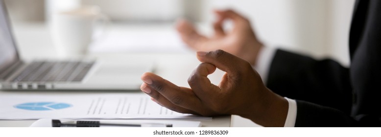 Close Up African Businessman Sitting At Desk Near Laptop Stress Relief At Workplace, Mental Health Internal Balance Concept, Horizontal Photo Banner For Website Header Design With Copy Space For Text