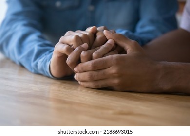 Close Up African Couple Holding Hands, Demonstrate Support, Express Trust, Say Sorry. Family Reconciliation, Understanding In Relationships, Feelings, Love, Confidential Conversation, Apology