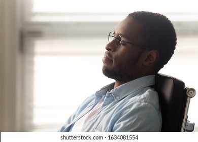 Close Up African Office Worker Closed Eyes Resting Enjoy Break Dreaming About Future Career Growth, Seated On Ergonomic Chair Correct Lumbar Support Of Posture, Maximum Comfort During Sitting Concept