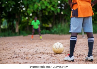 Close Up Of African Player Standing Behind Football, Taking Penalty Kick - Concept On Sports, Exercise And Competitions.