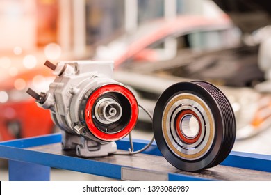 Close Up The Air Compressor Of The Car In The Repair Garage Is The Spare Parts To Cool The Car.