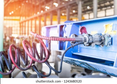 Close Up Air Joint And Valve Of Air Supply Brake System With Truck In Factory Background