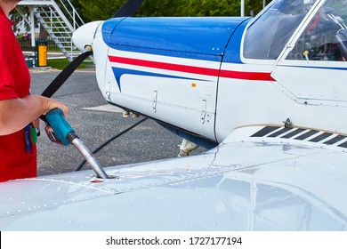 close-aircraft-worker-fueling-lowwing-26