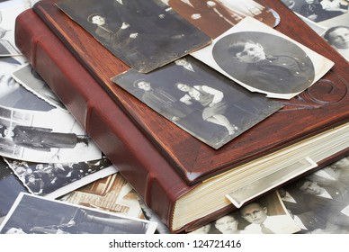 Close up of an album and ancient family photos - Shutterstock ID 124721416
