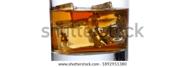 Close up of alcohol drink chilled for\
good taste in clear cup isolated on white\
background