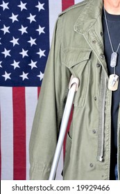 Close up of American veteran with crutch and flag in background