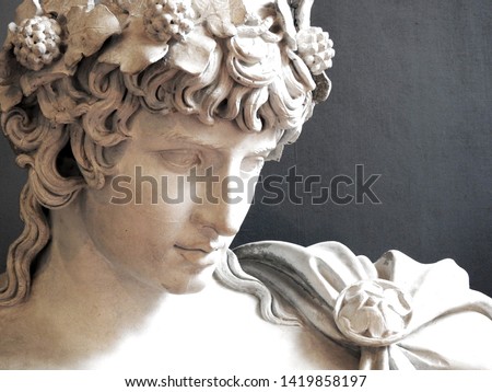 Close up of Ancient Greek Roman sculpture of Antinous dressed as god of wine Dionysus lover of Emperor Hadrian
