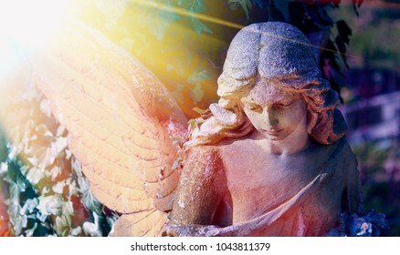 Close Up Of An Ancient Statue Of Guardian Angel (vintage Style Photo)