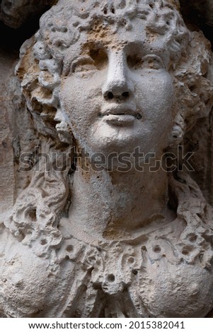Close up an ancient stone statue of Olympic goddess of beauty and love in antique mythology Aphrodite (Venus). 