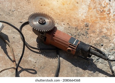   Close Up Angle Grinder With Sanding Discs On Concrete Floor Grinder