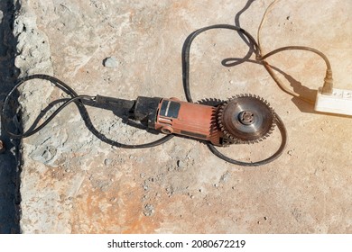   Close Up Angle Grinder With Sanding Discs On Concrete Floor Grinder