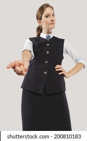 Close Up Of Angry Young Air Hostess Pointing