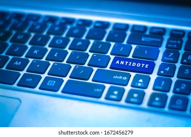 Close up antidote/ health concept - ANTIDOTE on the key command of the keyboard glowing in blue colour as the symbol of hope. Selective focus. - Shutterstock ID 1672456279