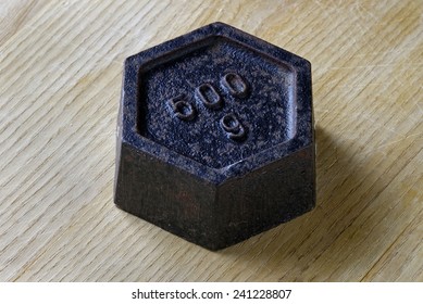 Close Up Of An Antique 500 Gram Weight. Measurement Concept.