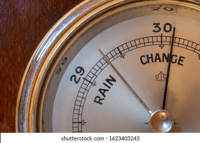 Close up of an antique barometer indicating high pressure