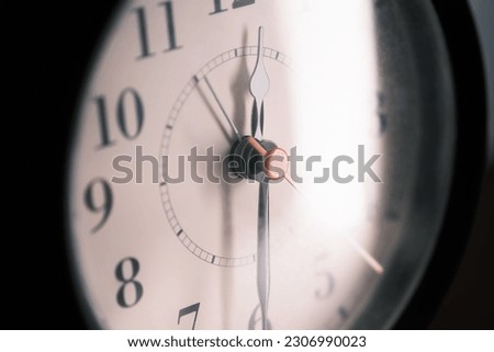 Close up of an antique clock isolated on dark background