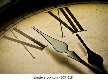 Close Up Of An Antique Clock And The Time Is Almost Midnight. Concept Of Time,the Past Or Deadline.