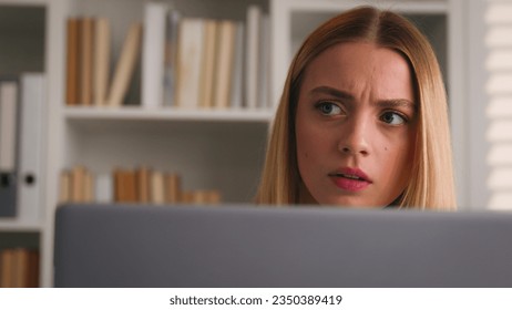 Close up anxiety worried Caucasian businesswoman with computer in office serious girl frown puzzled stressed woman thinking business solution problem thoughtful working online at laptop corporate app - Shutterstock ID 2350389419