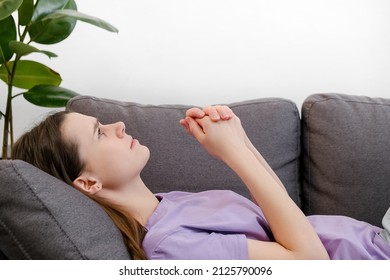 Close Up Of Anxious Young Brunette Woman Lying On Pillow, Feeling Doubtful Making Difficult Decision. Nervous Unhappy Caucasian Girl Suffering From Negative Thoughts, Relationship Problems Concept