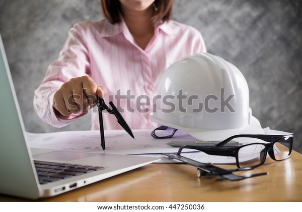 Close
up Architect working on blueprint. Architects workplace ,
architectural  working of Architect sketching a construction
project on his plane project. Construction
concept