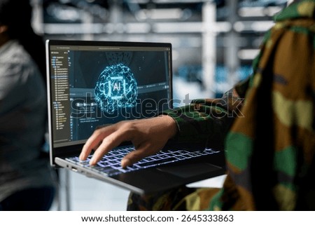 Close up of army tech expert in data center running simulations with military grade defense artificial intelligence. Server farm worker configuring AI dashboards to support mission decisions