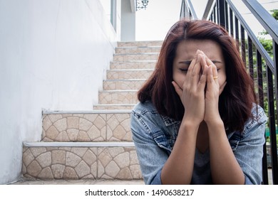 Close Up Asia Sad Woman Sitting At Stair.Depression,sad,lonely Concept.