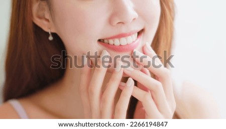 close up of asian beauty happy woman looking her health teeth in front of mirror 商業照片 © 