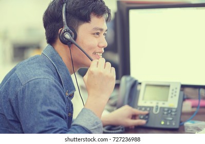 Close Up Asian Call Center Employee Man Working Smiling With Service-mind