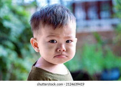 Close Up Of Asian Child Boy's Face With Tears. Upset Crying And Mad Little Toddler Boy. Eye Drop, Teardrop Of Little Sweetheart Kid. An Emotional Child Misses His Mom. Childhood Concept 